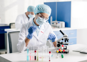 Life Sciences Queensland - Scientist using lab equipment and microscope