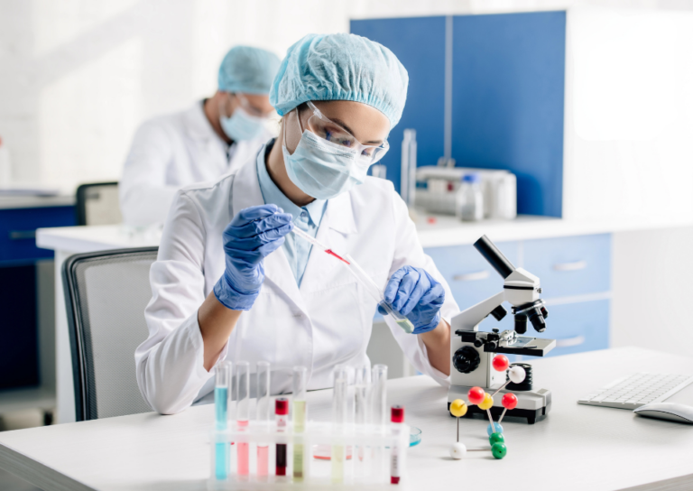 Life Sciences Queensland - Scientist using lab equipment and microscope